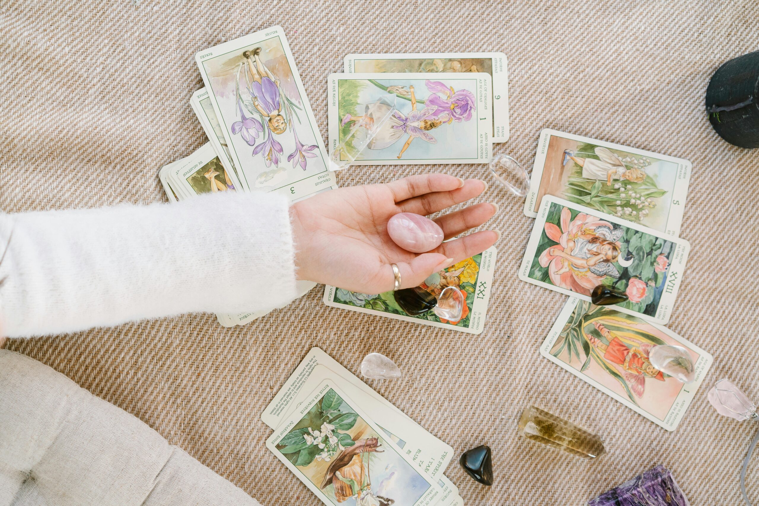 A serene setup of tarot cards and crystals invites insight and introspection.